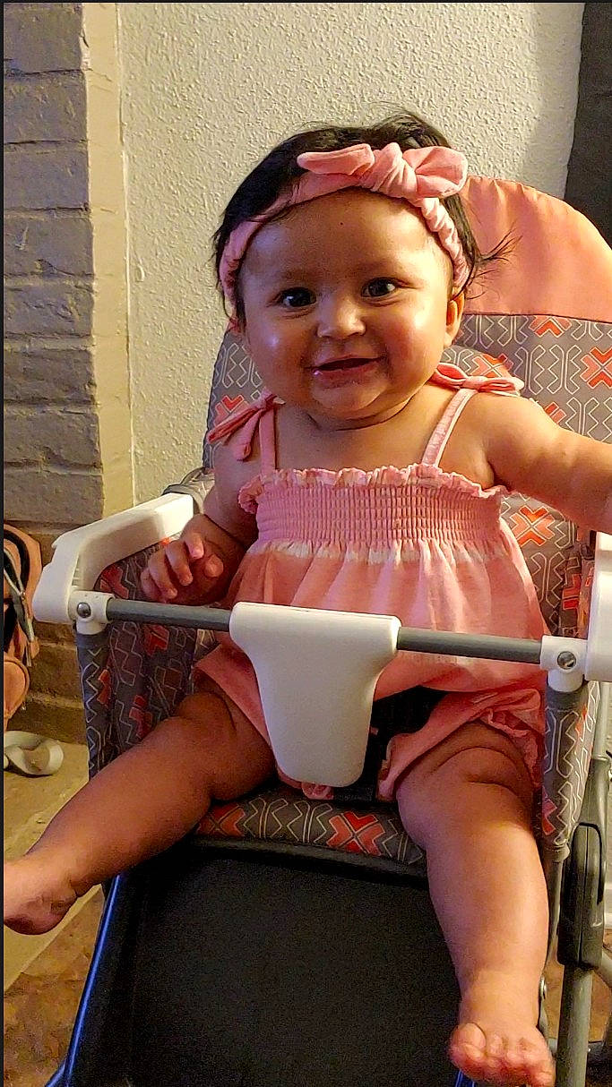 Leia joined the competition — help win amazing prizes! baby, baby_toddler_clothing, cheek, child, facial_expression, finger, fun, goggles, hairstyle, happy, headwear, human_leg, joy, knee, lip, person, pink, sitting, skin, smile