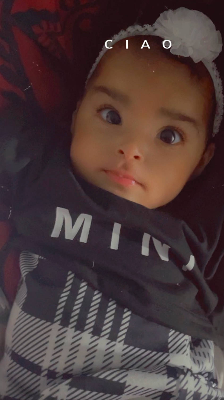 Leah is registered to the contest to win money with this photo: baby, baby_carriage, cap, cheek, child, eyebrow, eyelash, fashion_accessory, flash_photography, happy, hat, headgear, lip, nose, person, plant, sleeve, t_shirt, toddler, tree