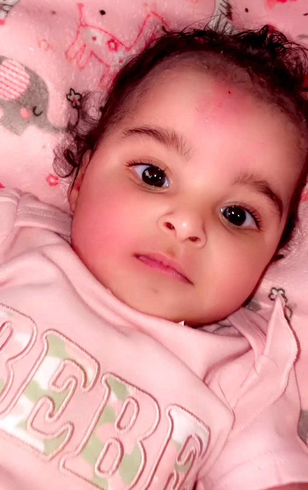 Leah is registered to the contest to win money with this photo: black_hair, cheek, chin, cool, eyebrow, eyelash, facial_expression, flash_photography, forehead, hairstyle, happy, human, iris, lip, mouth, nose, person, pink, skin, sleeve