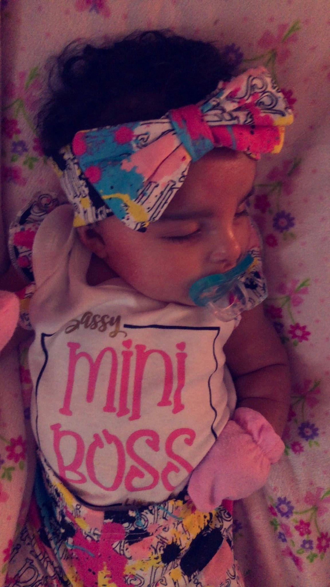 Leah is registered to the contest to win money with this photo: baby, baby_toddler_clothing, cheek, child, cool, fashion_accessory, happy, lip, magenta, neck, pattern, peach, person, pink, purple, skin, sleeve, t_shirt, textile, toddler