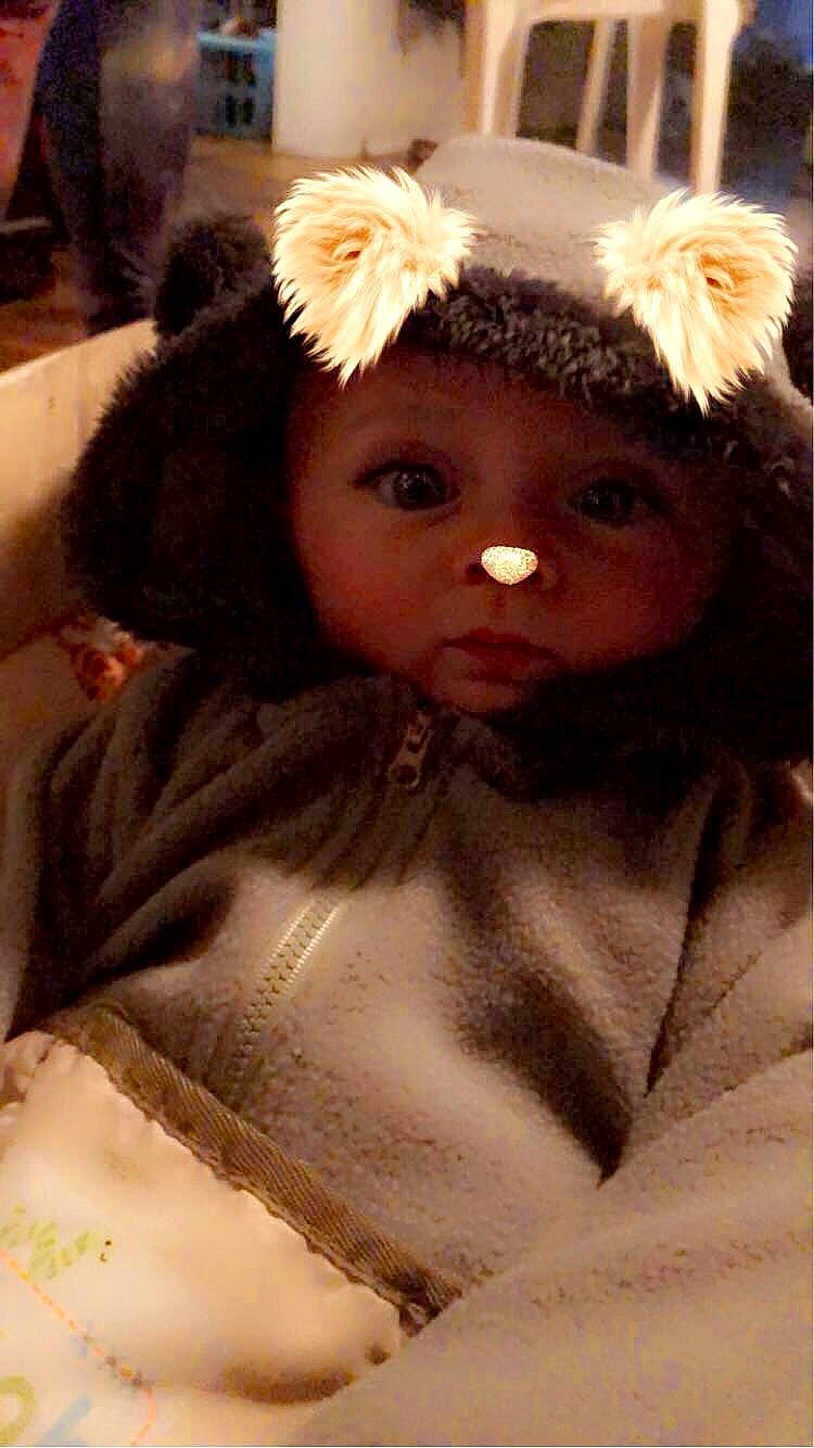 Landon is registered to the contest to win money with this photo: cap, cheek, chin, costume_hat, doll, eye, eyebrow, eyelash, fawn, fur_clothing, headband, headpiece, headwear, human_body, iris, lip, long_hair, outerwear, person, toy