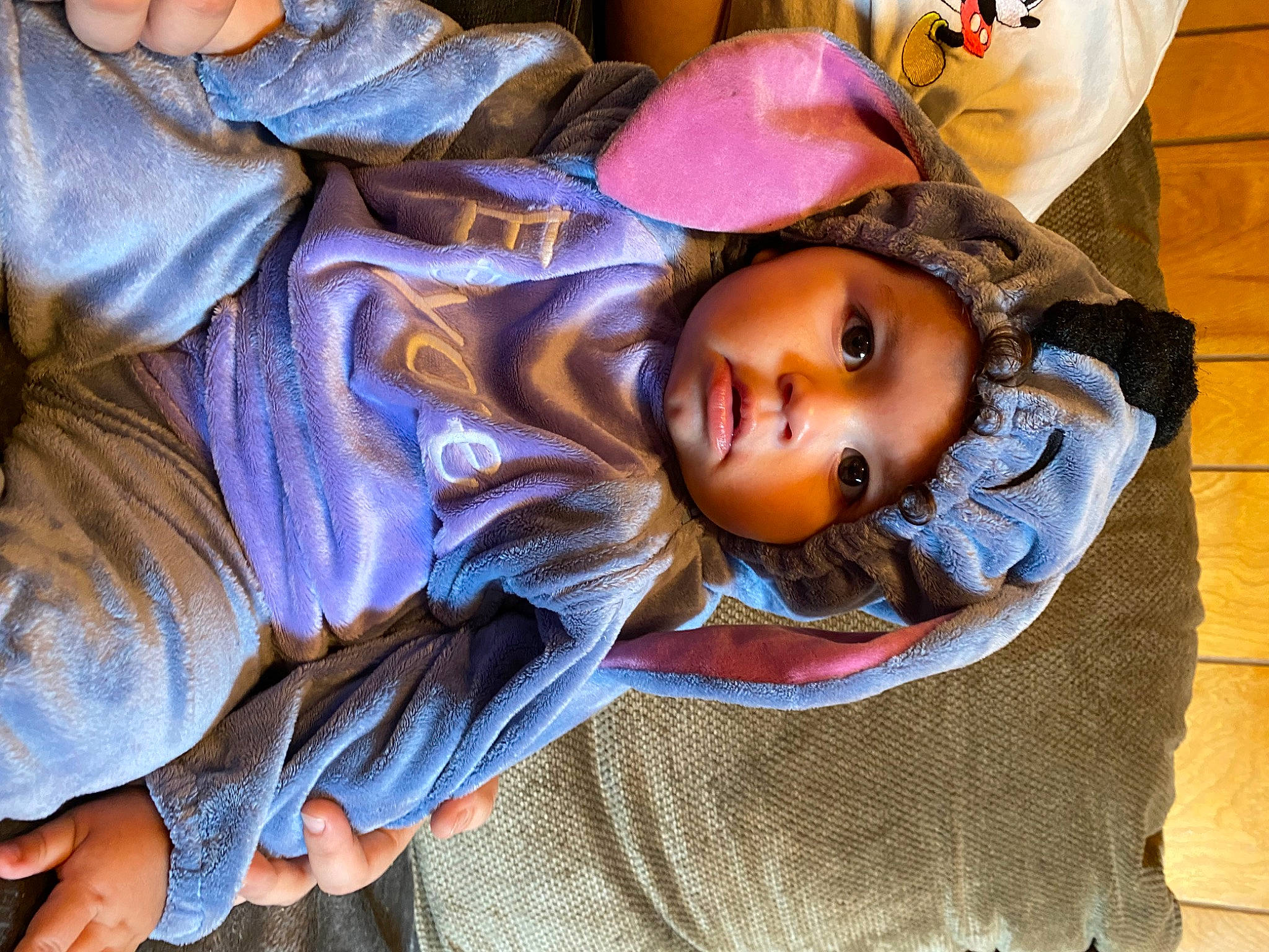 Stormie is registered to the contest to win money with this photo: cheek, child, comfort, eyebrow, flooring, fun, fur, hair, headwear, mouth, nap, nose, orange, person, purple, sitting, sleep, sunglasses, toddler, wood