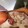 Aylani is registered to the contest to win money with this photo: newborn, baby, sleeping, hat, beanie, butterfly_pattern, onesie, infant, closeup, hand, adult_arm, peaceful, cute, soft, portrait, indoor, child, resting, skin, clothing