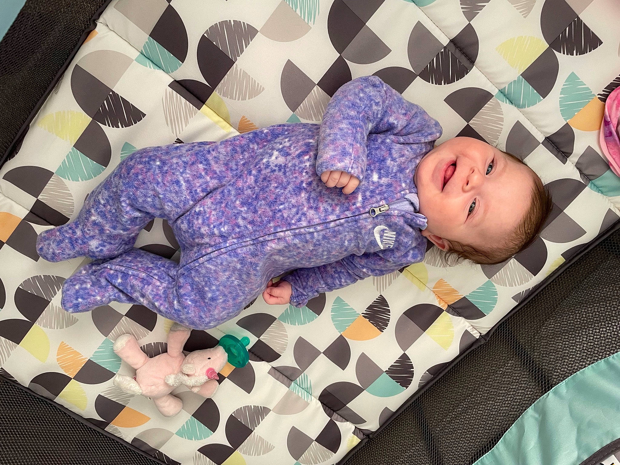 Paisley is registered to the contest to win money with this photo: baby_toddler_clothing, beauty, blue, comfort, cool, flooring, human_body, linens, magenta, pattern, person, pink, product, purple, rectangle, sleeve, smile, t_shirt, textile, toddler