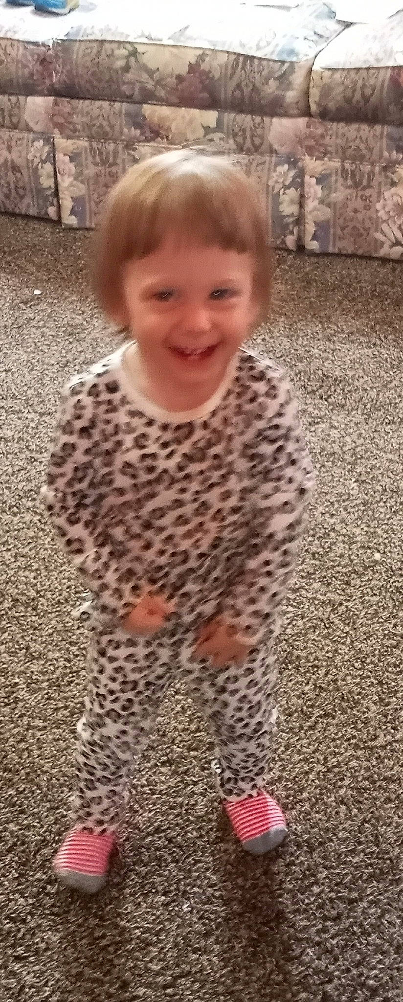 Betty is registered to the contest to win money with this photo: asphalt, child, city, eye, face, floor, flooring, fun, grass, hair, happy, head, joy, pattern, person, recreation, road_surface, sleeve, smile, standing