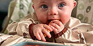 Finley is registered to the contest to win money with this photo: baby, child, high_chair, food, watermelon, snack, blue_eyes, face, hands, eating, indoor, close_up, cute, infant, feeding, plate, curious, healthy_food, blond_hair, person