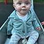 Finley joined the competition — help win amazing prizes! baby, child, slide, outdoor, playground, jacket, pants, sock, face, blue_eyes, sitting, curious, hand, toy, pacifier, light_blue, clothing, infant, young_child, nature
