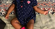 Lamiyah is registered to the contest to win money with this photo: baby, girl, infant, child, headband, pink, onesie, polka_dot, socks, cushion, pattern, indoor, cute, tongue_out, sitting, portrait, clothing, smiling, face, happy