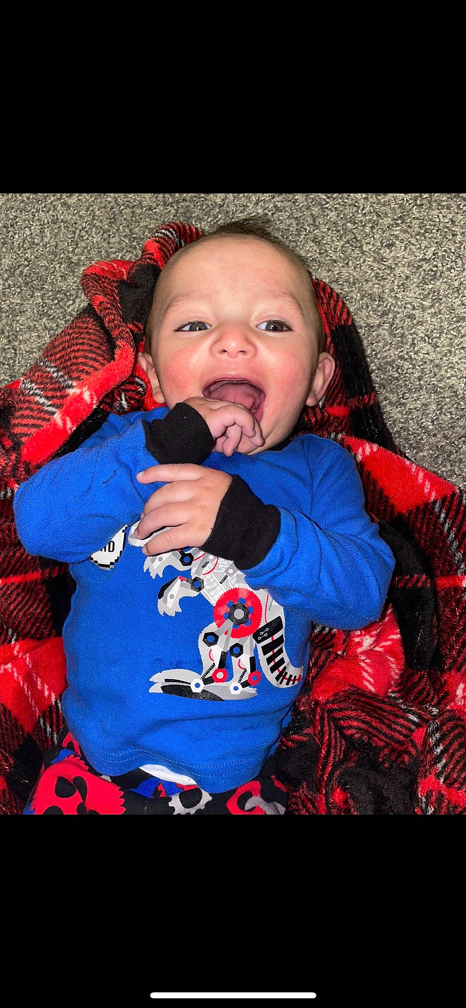 Bexley is registered to the contest to win money with this photo: baby, baby_products, baby_toddler_clothing, carmine, cheek, child, comfort, electric_blue, face, fun, happy, lip, nail, nose, orange, outerwear, pattern, person, sitting, sleeve