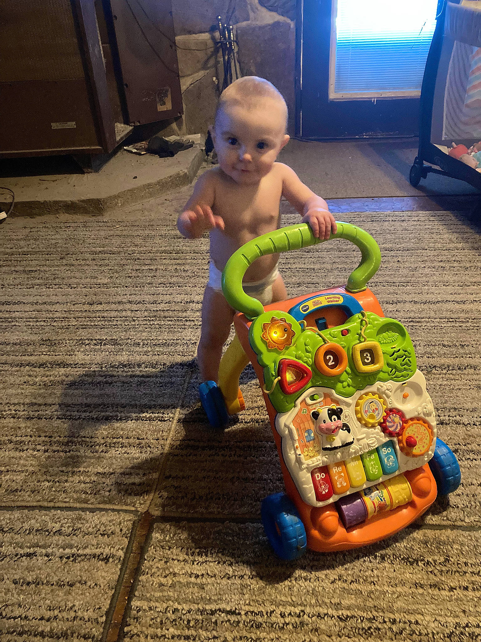 Skylee joined the competition — help win amazing prizes! baby, baby_products, baby_toddler_clothing, baby_toys, child, floor, flooring, fun, human_leg, person, plastic, play, recreation, room, sitting, television, toddler, toy, toy_vehicle, vacation
