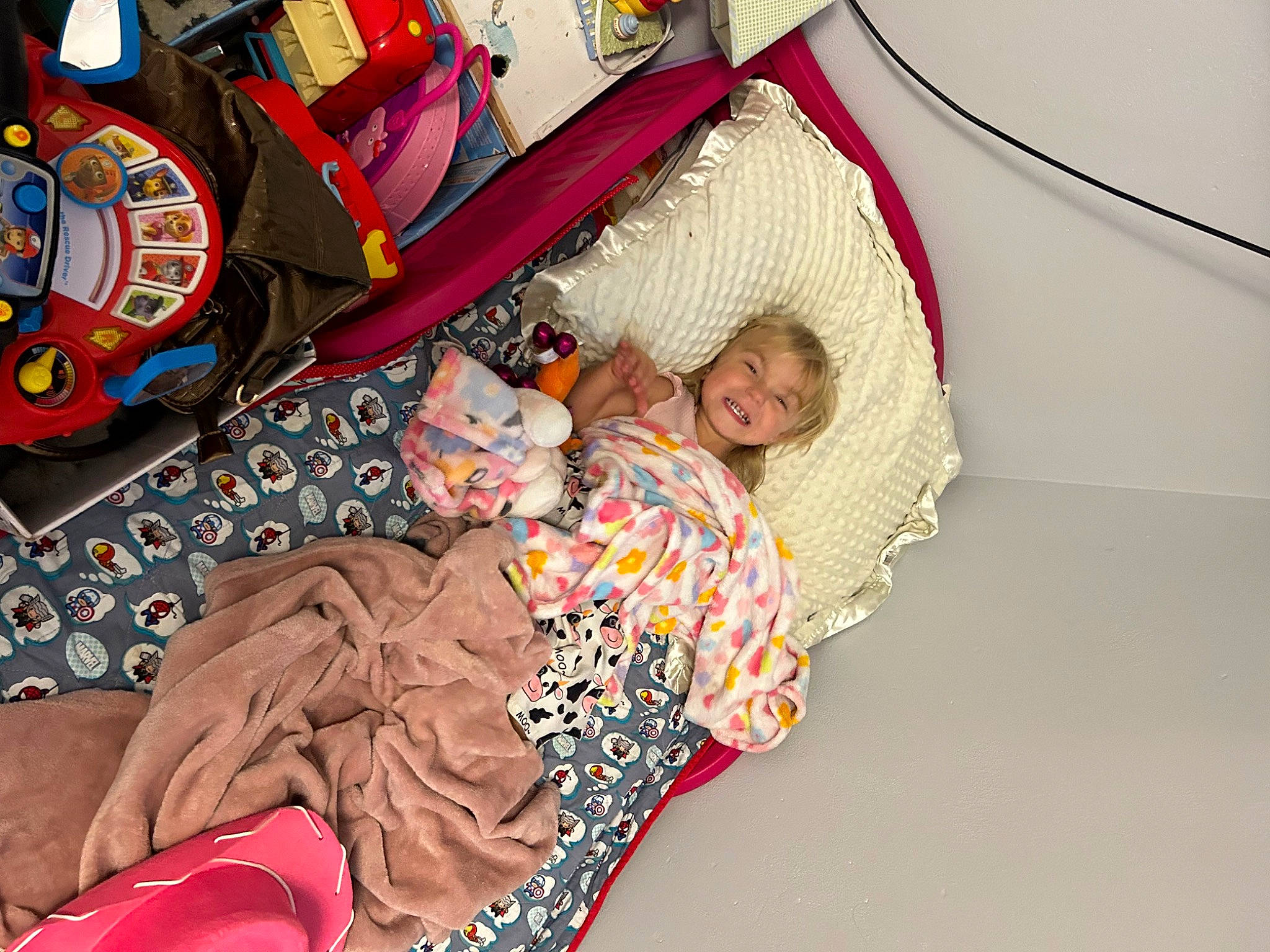 Skylee is registered to the contest to win money with this photo: baby_products, bed_sheet, bedding, bedtime, carmine, child, comfort, fun, joy, lap, leisure, linens, nap, pattern, person, room, sitting, sleep, smile, t_shirt