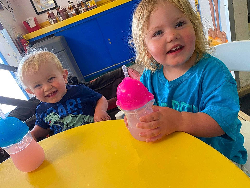 Holley is registered to the contest to win money with this photo: baby_playing_with_toys, blue, bookcase, child, facial_expression, finger, fun, hairstyle, hand, happy, joy, kindergarten, leisure, person, picture_frame, product, recreation, sharing, shelf, smile