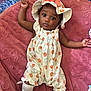 Gabriella joined the competition — help win amazing prizes! baby, infant, child, romper, hat, blanket, plush, pink, orange_print, socks, lying_down, curious, wide_eyes, cute, indoors, soft_texture, clothing, person, portrait, baby_supplies