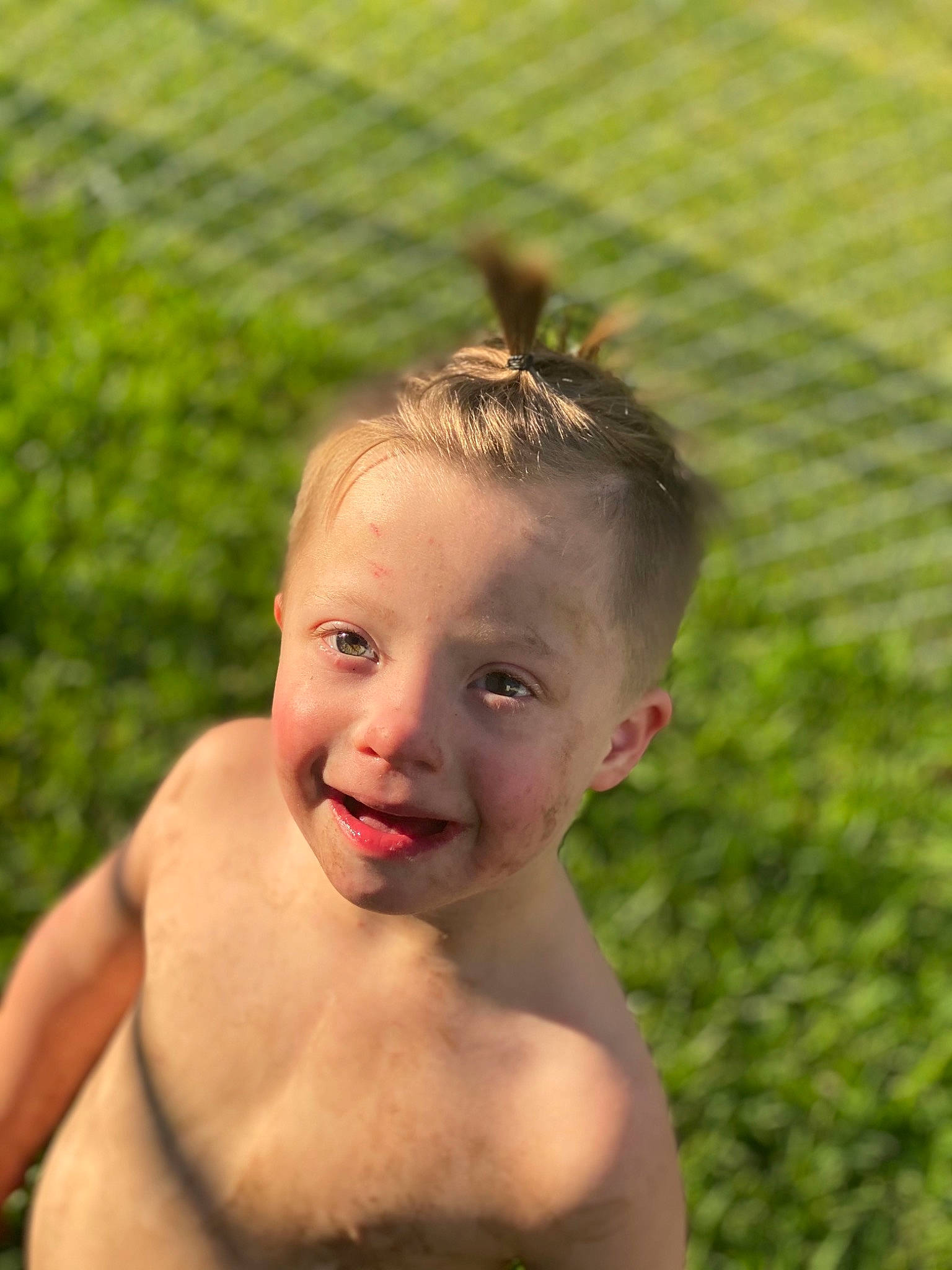 Allen is registered to the contest to win money with this photo: abdomen, barechested, bathing, chest, child, face, fun, grass, grassland, hair, happy, laugh, leisure, people_in_nature, person, recreation, skin, smile, swimwear, toddler