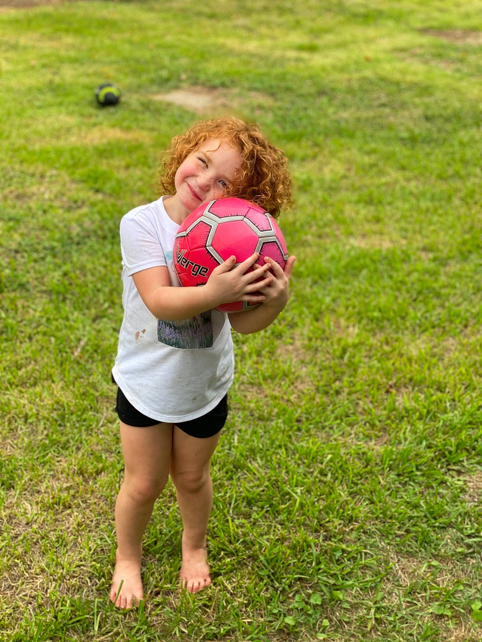 Madilynn is registered to the contest to win money with this photo: ball, ball_game, football, fun, grass, grass_family, happy, joy, leisure, people_in_nature, person, plant, player, playing_sports, playing_with_kids, rugby_ball, shorts, soccer_ball, sports, sports_equipment