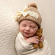 Naevee joined the competition — help win amazing prizes! baby, newborn, sleeping, hat, knitted_hat, lace_bow, blanket, wrapped, teddy_bear, soft_texture, cream_color, peaceful, cute, infant, portrait, child, cozy, adorable, hand, smile
