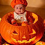 Octavyus is registered to the contest to win money with this photo: baby, pumpkin, jack_o_lantern, halloween, costume, orange, cute, infant, holiday, decorations, fall, leaves, smile, face, hat, bib, toy, sitting, festive, indoors