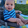 baby, child, smiling, blue_shirt, striped_shirt, outdoor, grass, chair, play_mat, happy, face, person, cute, summer, daylight, nature, legs, hand, seat, infant