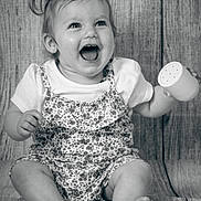 Adèle a rejoint le concours — aidez-le/la à gagner de superbes lots ! baby, child, smiling, laughing, pigtails, toy, sitting, portrait, black_and_white, clothing, cute, happy, infant, face, foot, hand, texture, fabric, background, playful