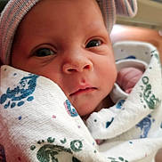 Myla is registered to the contest to win money with this photo: newborn, baby, face, blanket, headband, bow, portrait, closeup, infant, wrapped, soft, cute, eyes, expression, skin, child, cozy, hospital, newborn_baby, baby_clothing