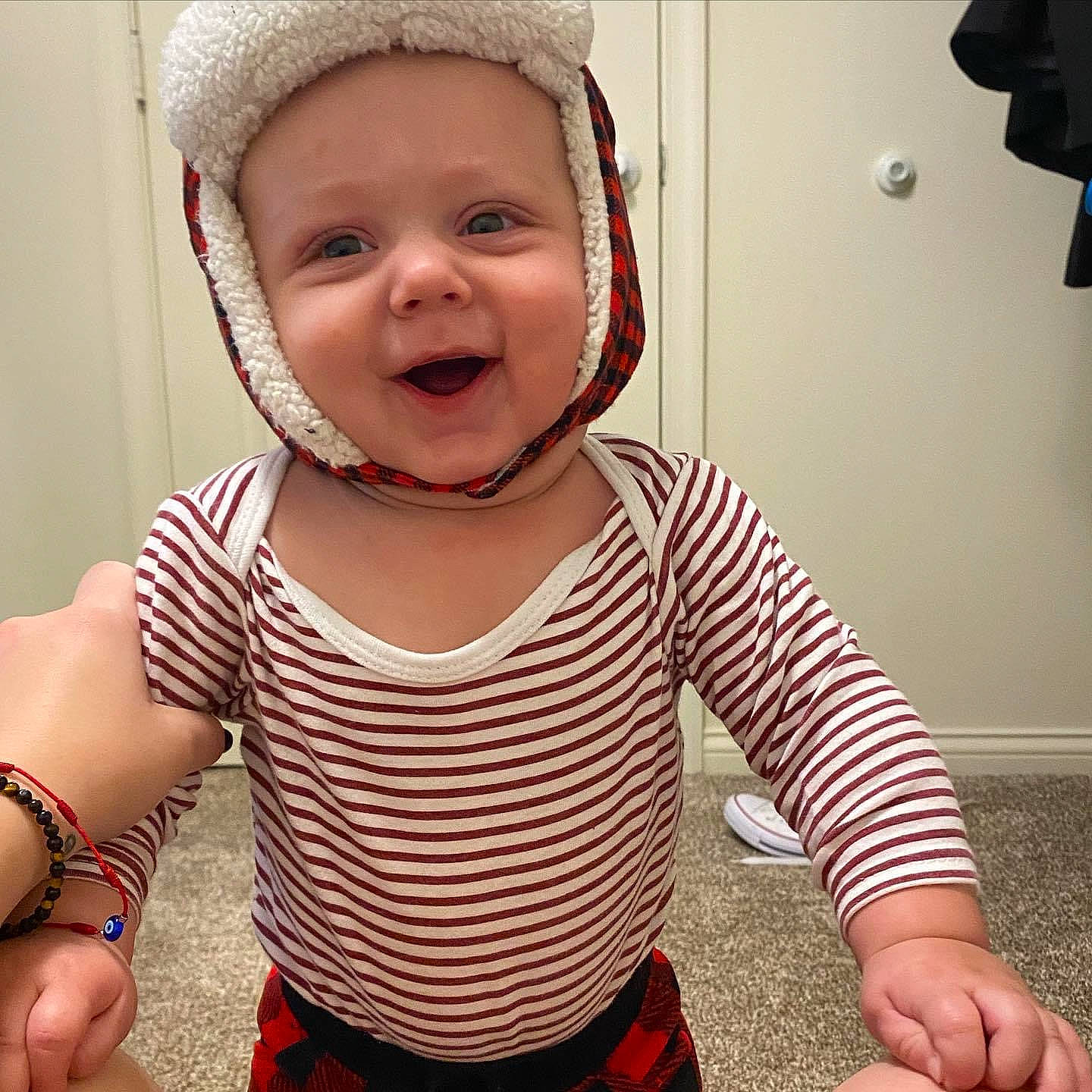 Elio is registered to the contest to win money with this photo: baby, baby_toddler_clothing, cheek, child, cool, eye, face, finger, happy, head, headwear, human_body, mouth, neck, nose, person, pink, skin, sleeve, smile