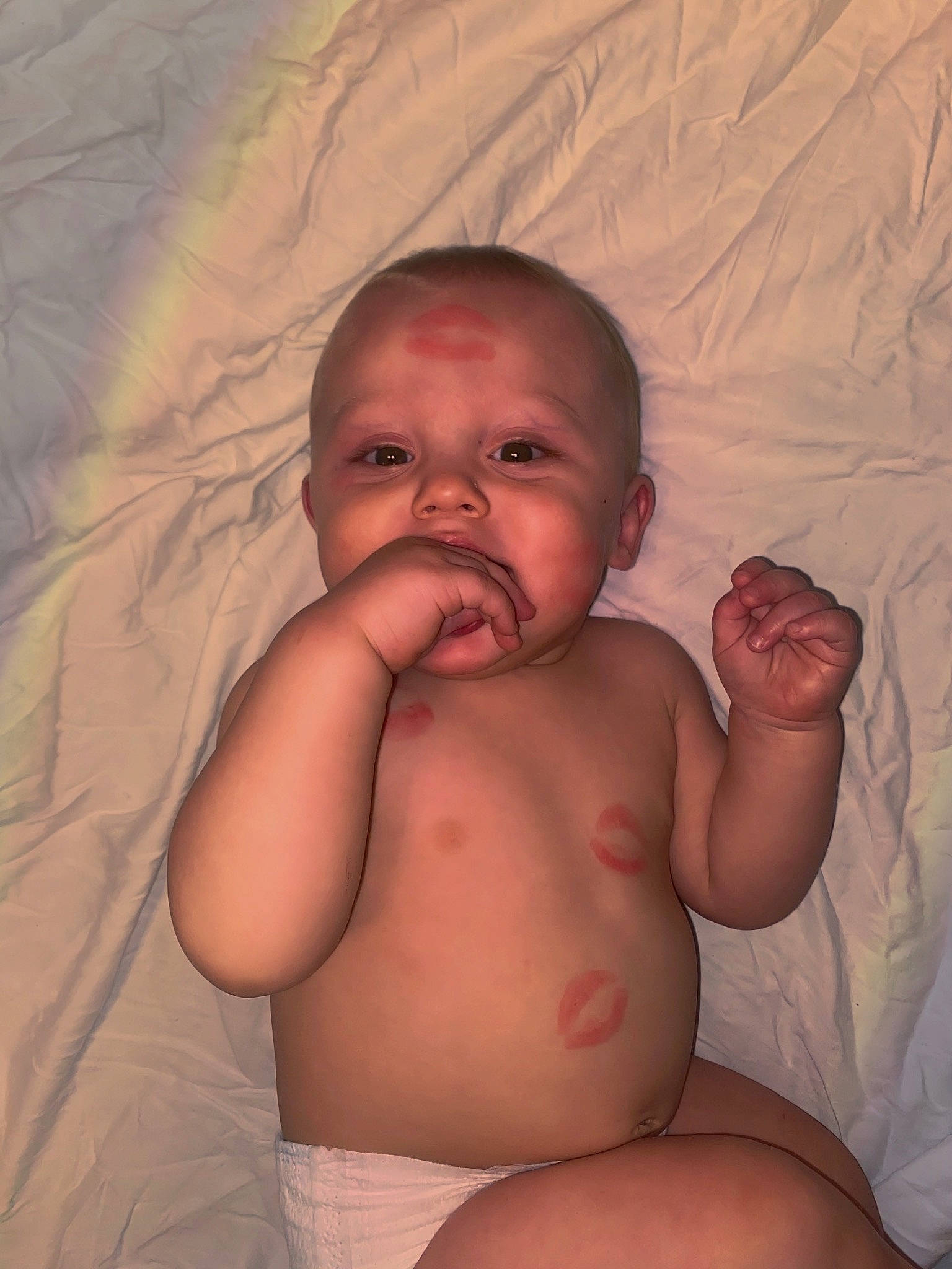 Elio is registered to the contest to win money with this photo: arm, baby, cheek, chin, comfort, eye, eyebrow, face, forehead, hair, hand, head, human_body, leg, lip, mouth, neck, nose, person, skin