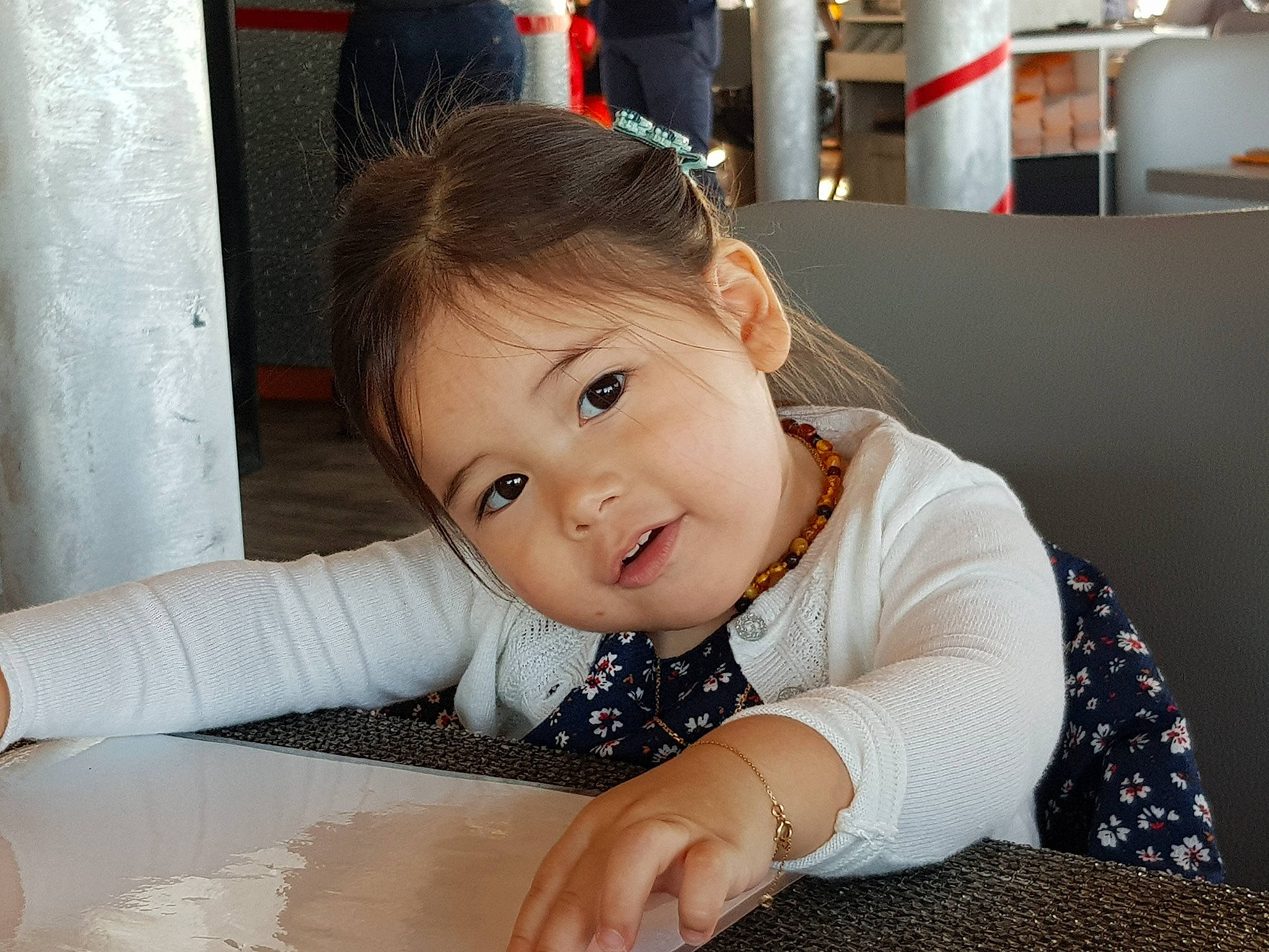 Viyada participe au concours pour gagner de l'argent avec cette photo : baby, baby_toddler_clothing, cheek, child, comfort, curtain, eye, floor, flooring, fun, happy, pattern, person, product, room, sitting, skin, sleeve, smile, toddler