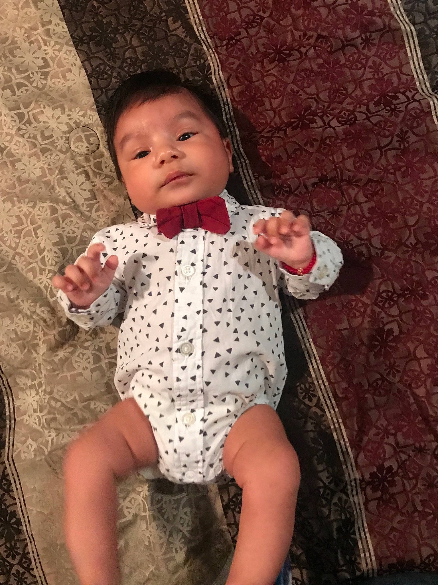 Iker is registered to the contest to win money with this photo: abdomen, black_hair, child, day, design, girl, happiness, human, infant, pattern, person, pink, plaid, polka_dot, product, skin, smile, textile, toddler, trunk