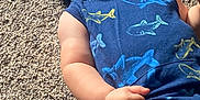 Arthur joined the competition — help win amazing prizes! baby, child, infant, blue_clothing, hoodie, shark_print, carpet, tongue_out, playful, cute, chubby_cheeks, lying_down, casual, indoor, person, small_hand, headwear, comfortable, relaxed, young