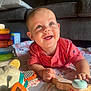 Arthur is registered to the contest to win money with this photo: baby, infant, smiling, toy, colorful_toys, blanket, quilt, indoor, child, cute, happy, playtime, couch, person, portrait, toddler, hand, face, clothing, wooden_toy