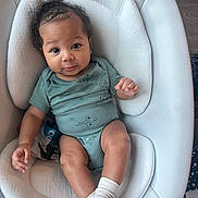 Ad joined the competition — help win amazing prizes! attention, baby, baby_seat, big_eyes, child, cozy, curly_hair, cushion, cute, hand, infant, legs, newborn, onesie, portrait, skin_tone, smile, sock, toy, wood_floor