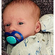 Anthony joined the competition — help win amazing prizes! baby, pacifier, blanket, infant, face, blue, clothing, newborn, sleepwear, texture, portrait, skin, head, eyes, hand, cozy, soft, indoors, screenshot, phone_interface
