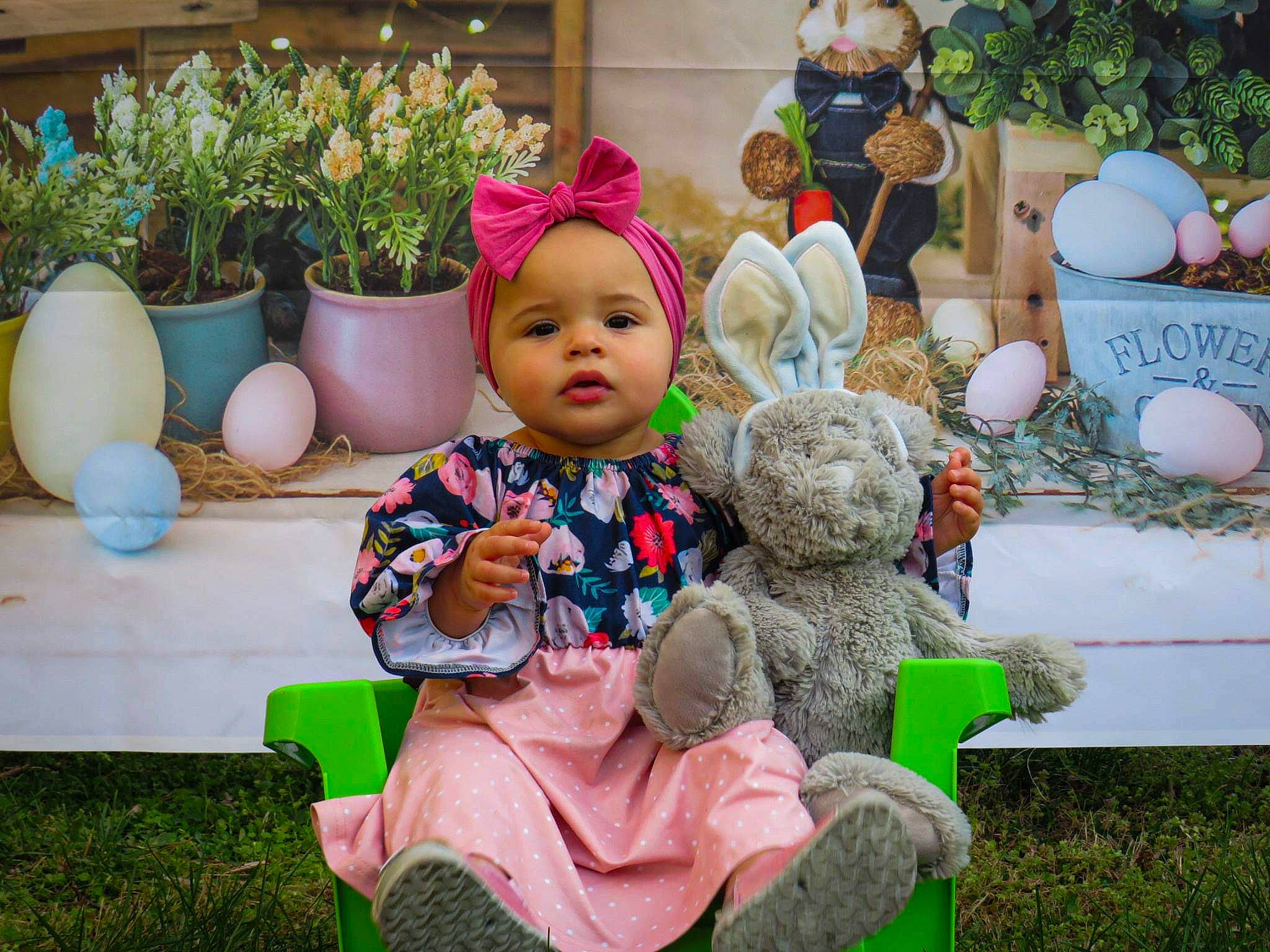 Brooklynn joined the competition — help win amazing prizes! child, doll, event, flower, flowerpot, garden, grass, happy, houseplant, human_settlement, leisure, mammal, person, pink, plant, public_space, sitting, summer, textile, toy