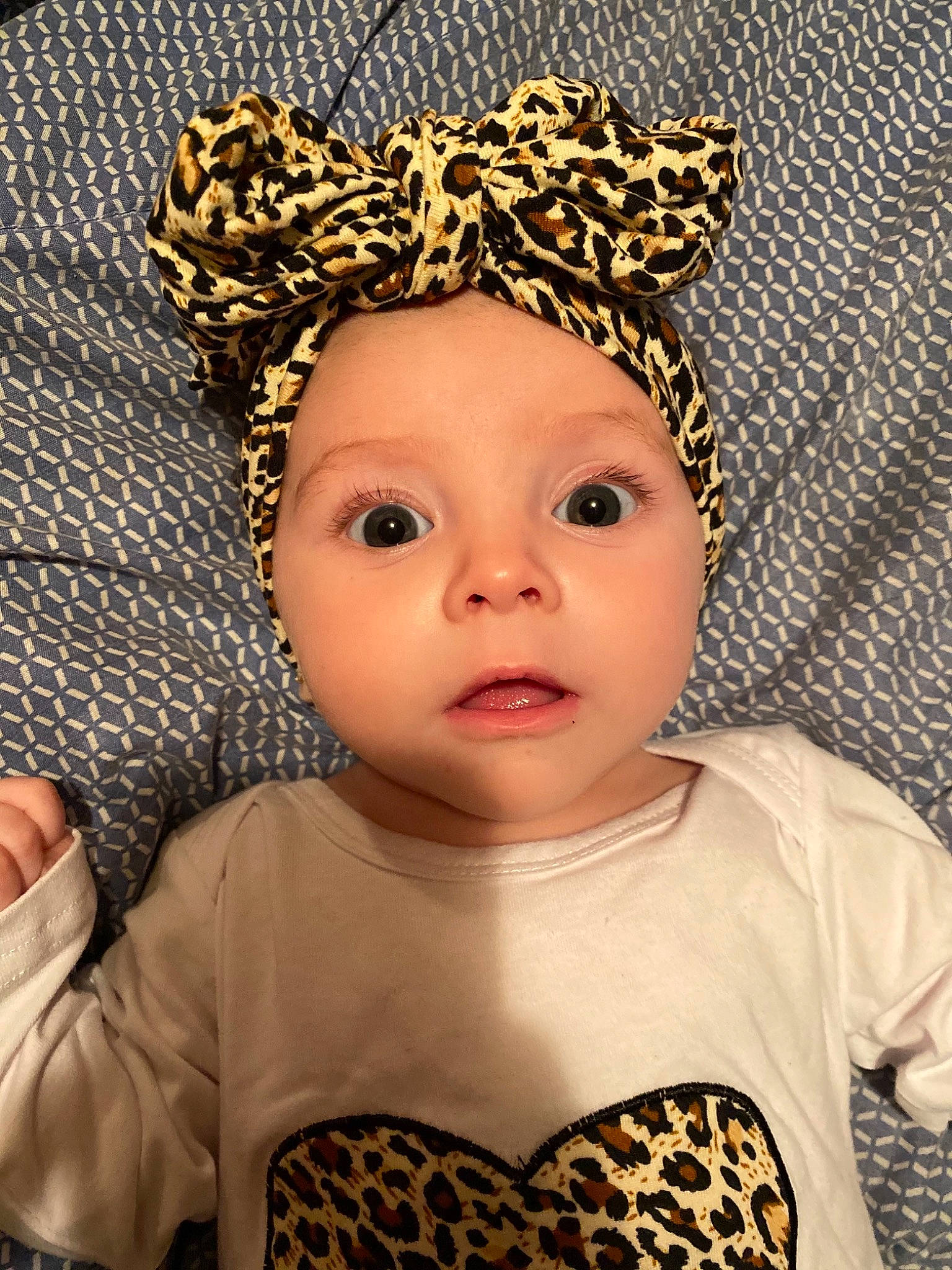 Kynzlee is registered to the contest to win money with this photo: baby_toddler_clothing, cap, cheek, chin, costume_hat, eye, eyebrow, eyelash, face, head, headwear, helmet, human_body, iris, lip, nose, organ, person, skin, sleeve