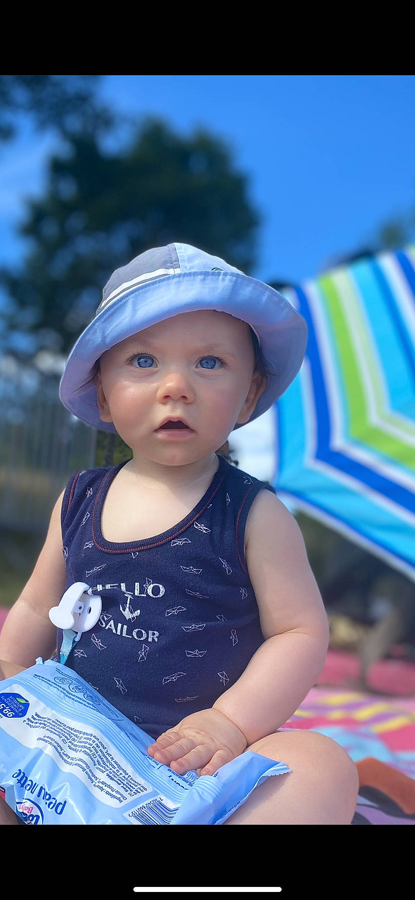 Mylann participe au concours pour gagner de l'argent avec cette photo : azure, baby_toddler_clothing, blue, cap, cool, electric_blue, facial_expression, flash_photography, fun, happy, hat, headwear, leisure, light, person, photograph, skin, summer, sun_hat, toddler