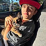 animal, boy, cap, car_seat, casual_clothing, cat, child, comfort, domestic_animal, fur, holding, indoor, kitten, outdoor_view, pet, portrait, shadow, sunlight, trees, window