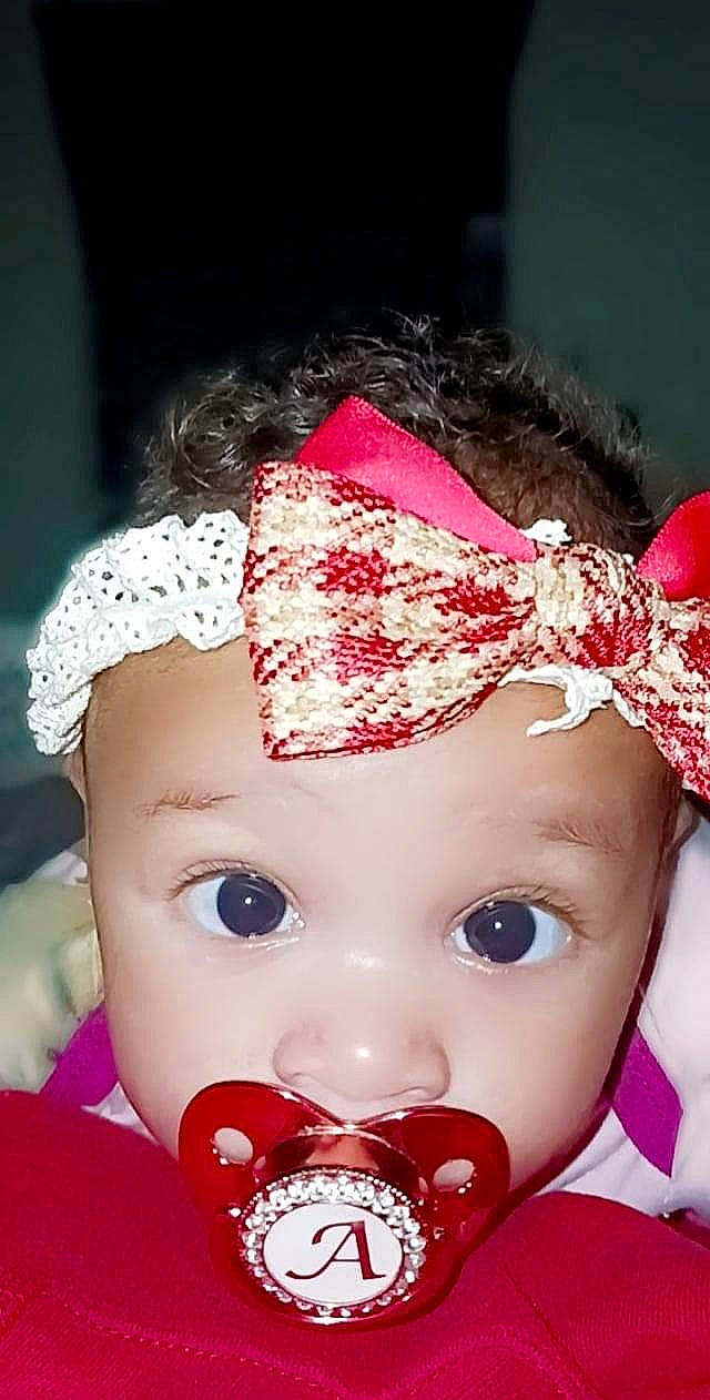 Amber joined the competition — help win amazing prizes! cap, child, costume, costume_hat, doll, eyelash, fashion_accessory, hair_accessory, hairstyle, headband, headgear, headpiece, lip, lipstick, magenta, person, petal, pink, toddler, toy