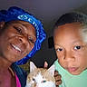 Nelly is registered to the contest to win money with this photo: woman, boy, cat, indoor, selfie, bonnet, green_shirt, orange_cat, white_cat, face, portrait, closeup, people, pet, animal, expression, looking_at_camera, casual, home, intimate_moment