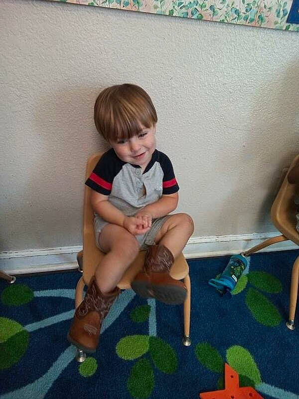 Levi joined the competition — help win amazing prizes! baby, baby_toddler_clothing, child, comfort, couch, floor, flooring, fun, grass, human_body, human_leg, joy, knee, leg, leisure, person, shorts, sneakers, sock, thigh