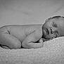 newborn, baby, sleeping, black_and_white, portrait, infant, soft, blanket, peaceful, cute, resting, child, skin, head, face, hand, lying_down, cozy, tender, young