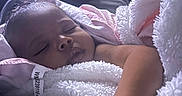 Harmony is registered to the contest to win money with this photo: arm, baby, blanket, child, comfort, cozy, cute, face, indoors, infant, newborn, peaceful, portrait, relaxation, rest, skin, sleeping, soft_light, towel, wrapped
