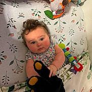 Willow is registered to the contest to win money with this photo: applique, baby, bed, blanket, bodypart, couch, crib, cushion, face, finger, furniture, hand, head, homedecor, infantbed, person, photography, plush, portrait, toy