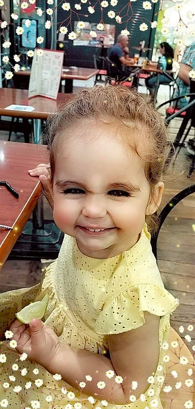 Inaya participe au concours pour gagner de l'argent avec cette photo : baby_toddler_clothing, bicycle_wheel, bicycles_equipment_and_supplies, chair, cheek, chin, dress, eyelash, facial_expression, happy, human, joy, lip, organ, person, photograph, skin, sleeve, smile, tire