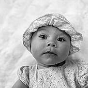 Valentina Laurent participe au concours pour gagner de l'argent avec cette photo : baby, child, black_and_white, portrait, hat, clothing, face, cute, infant, young_child, eyes, expression, closeup, fabric, texture, soft_light, innocence, headwear, sleeves, background