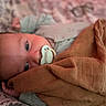 Jaxson is registered to the contest to win money with this photo: baby, pacifier, blanket, bed, sleepwear, infant, face, closeup, lying_down, cozy, soft_texture, child, portrait, indoor, resting, newborn, cute, peaceful, human, warm