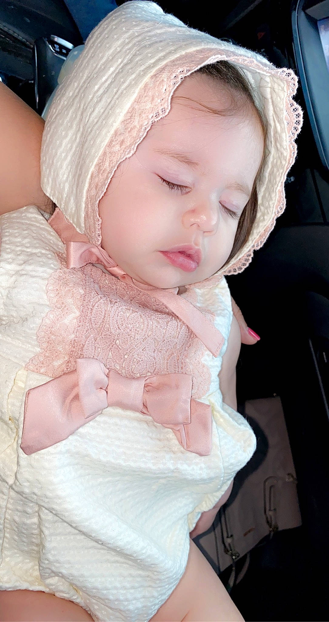 Kaylani Hadassah Mccormick is registered to the contest to win money with this photo: baby, baby_products, baby_toddler_clothing, cap, cheek, dress, embellishment, eye, eyelash, face, head, headgear, headwear, human_body, iris, lip, outerwear, person, pink, skin