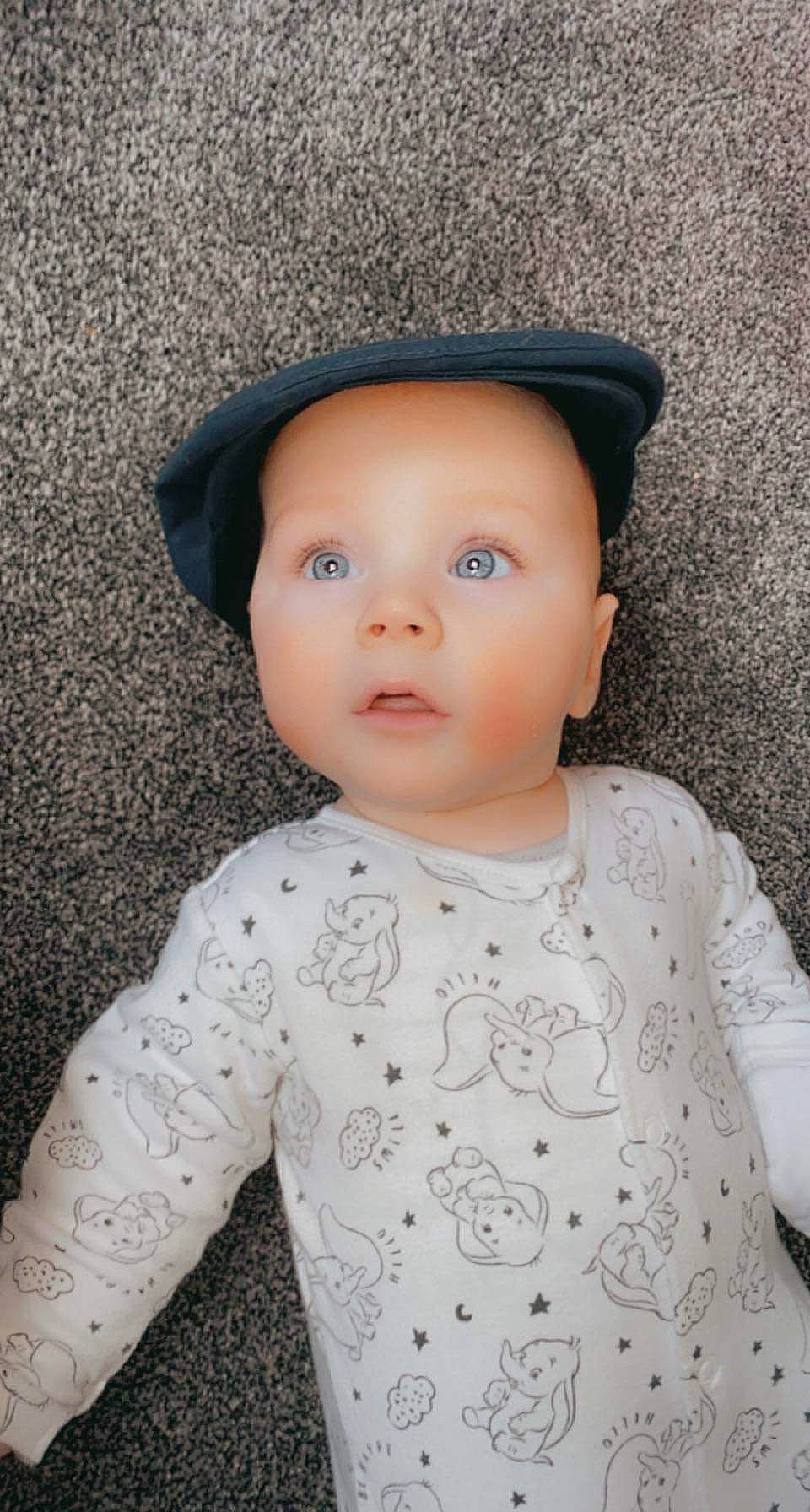 Cory joined the competition — help win amazing prizes! baby, baby_toddler_clothing, cap, child, electric_blue, eye, face, fashion_accessory, flash_photography, grey, hat, head, iris, lip, monochrome_photography, pattern, person, skin, sleeve, sun_hat