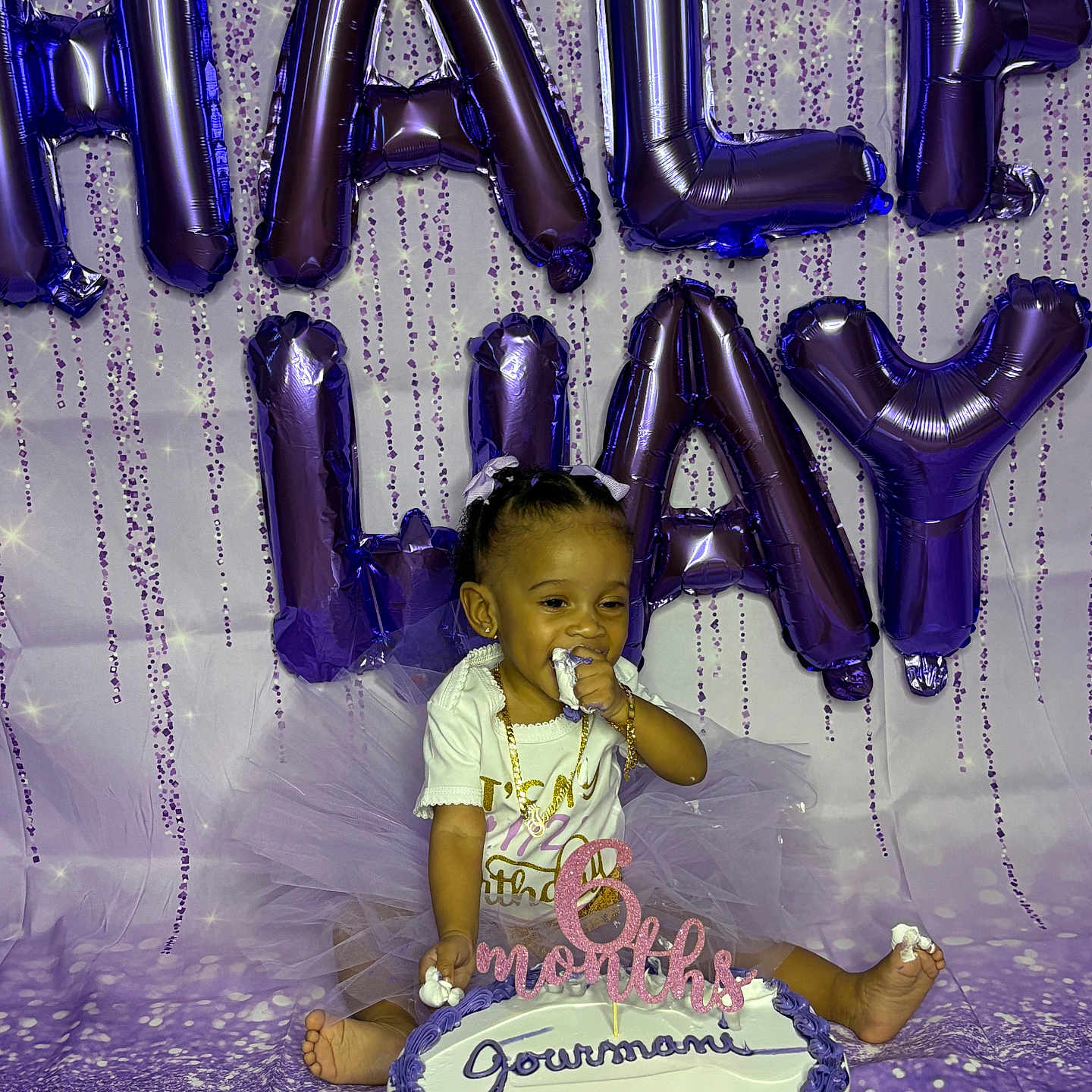 Jourmani joined the competition — help win amazing prizes! baby, balloons, birthday, cake, celebration, child, decorations, feet, festive, frosting, gold_jewelry, hands, happy, infant, milestone, party, purple, sitting, smiling, tutu