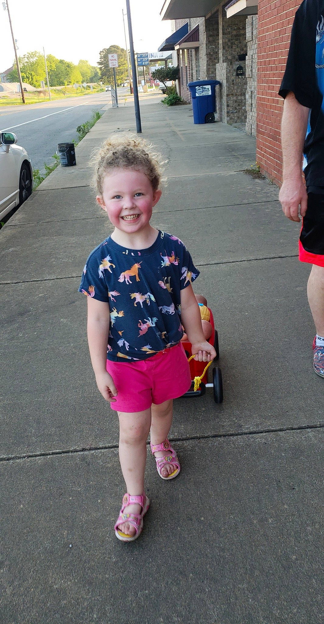 Jayde is registered to the contest to win money with this photo: asphalt, car, cool, eyewear, face, facial_expression, hairstyle, happy, joint, joy, leg, mammal, person, pink, plant, public_space, shoe, shorts, smile, standing