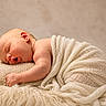 Presley is registered to the contest to win money with this photo: baby, newborn, sleeping, pillow, blanket, knit, soft, cozy, infant, wrapped, cute, peaceful, skin, lying_down, rest, child, portrait, warm, comfort, indoors